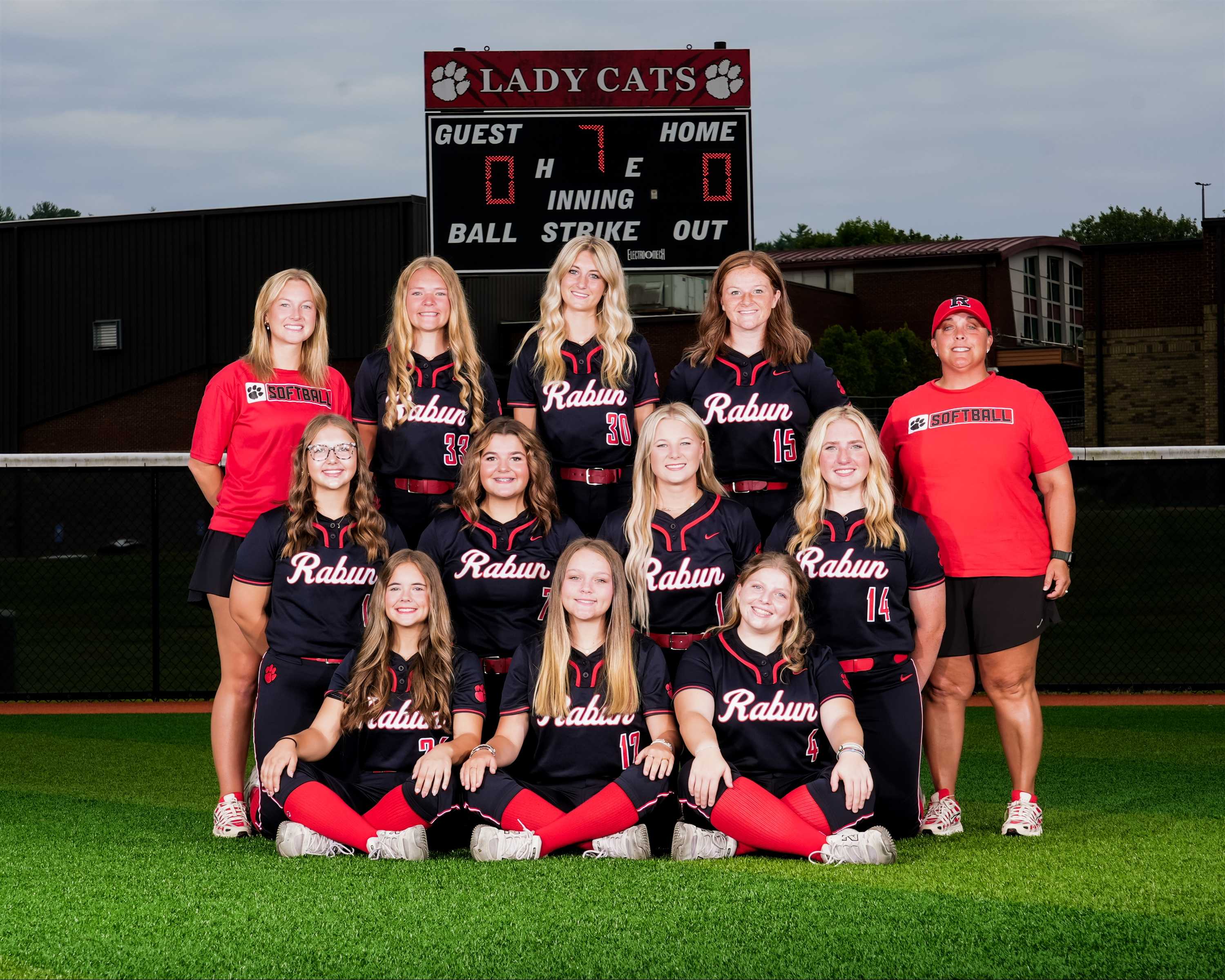 varsity softball team and coaches